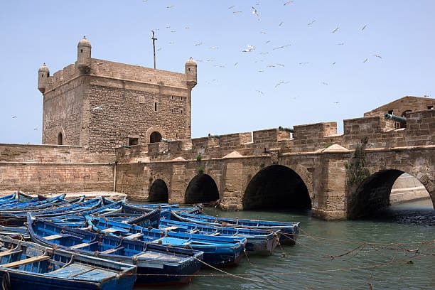 Essaouira Mogador Portuguese fort surrounded now by small fishing boats